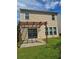 Backyard featuring a covered patio area and the rear exterior of the home at 1692 Woodsford Nw Rd, Kennesaw, GA 30152