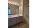 Spacious bathroom with a double sink vanity, a large mirror, and a shower-tub combo at 1692 Woodsford Nw Rd, Kennesaw, GA 30152