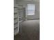 Bright bedroom featuring carpet floors and built in bookshelves, creating cozy space at 1692 Woodsford Nw Rd, Kennesaw, GA 30152