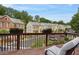 Balcony with wooden floor and railings showcasing serene community views at 2268 Limehurst Ne Dr # 120, Atlanta, GA 30319