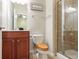 Contemporary bathroom featuring a wood vanity, a toilet, and a glass shower at 2268 Limehurst Ne Dr # 120, Atlanta, GA 30319