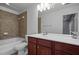 Full bathroom with tiled shower and double sink vanity with tile floors at 2268 Limehurst Ne Dr # 120, Atlanta, GA 30319