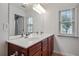 Bathroom with a double sink vanity, white countertops and lots of light at 2268 Limehurst Ne Dr # 120, Atlanta, GA 30319