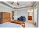 Cozy bedroom with decorative ceiling, dresser, arm chair, and view to the ensuite bathroom at 2268 Limehurst Ne Dr # 120, Atlanta, GA 30319