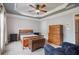 Comfortable bedroom with ceiling fan, wood furniture, a king bed, and ample natural light at 2268 Limehurst Ne Dr # 120, Atlanta, GA 30319