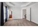 Bright bedroom with carpet, white walls and trim, with entry to bathroom and stairway visible at 2268 Limehurst Ne Dr # 120, Atlanta, GA 30319