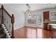 Bright dining area with hardwood floors, modern lighting, and access to the kitchen and backyard at 2268 Limehurst Ne Dr # 120, Atlanta, GA 30319