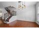 Formal dining room showcasing modern lighting fixtures, hardwood floors, and classic wainscoting detail at 2268 Limehurst Ne Dr # 120, Atlanta, GA 30319