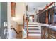 Inviting foyer featuring hardwood floors, staircase with iron railing, and elegant decor at 2268 Limehurst Ne Dr # 120, Atlanta, GA 30319