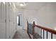 Bright hallway with neutral carpet, white walls, and closet doors at 2268 Limehurst Ne Dr # 120, Atlanta, GA 30319