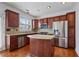 Modern kitchen features stainless steel appliances and granite countertops, with a central island at 2268 Limehurst Ne Dr # 120, Atlanta, GA 30319