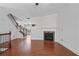 Cozy living room featuring hardwood floors, fireplace, and a view of the staircase leading upstairs at 2268 Limehurst Ne Dr # 120, Atlanta, GA 30319