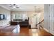 Spacious living room with hardwood floors, chandelier, staircase, and ample natural light at 2268 Limehurst Ne Dr # 120, Atlanta, GA 30319