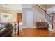 Bright living room with hardwood floors, chandelier, and staircase with iron railing at 2268 Limehurst Ne Dr # 120, Atlanta, GA 30319