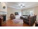 Open living room with fireplace, hardwood floors, comfortable seating, and large windows at 2268 Limehurst Ne Dr # 120, Atlanta, GA 30319
