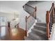 Elegant foyer featuring a staircase with iron spindles and hardwood floors at 2268 Limehurst Ne Dr # 120, Atlanta, GA 30319