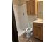 Functional bathroom featuring shower, toilet, sink with cabinet and overhead storage at 260 Amanda Ct, Stockbridge, GA 30281