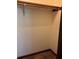 An empty closet with painted walls and a wood clothes rod at 260 Amanda Ct, Stockbridge, GA 30281