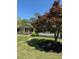 Charming single-story home featuring a well-manicured lawn and mature trees providing ample shade at 260 Amanda Ct, Stockbridge, GA 30281