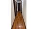 Hallway with wooden floors and neutral walls, offering flow through the home at 260 Amanda Ct, Stockbridge, GA 30281