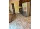 Kitchen featuring stainless steel appliances, wooden cabinets, and tile flooring at 260 Amanda Ct, Stockbridge, GA 30281