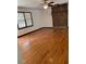 Spacious living room with hard wood floors, brick accent wall, and many windows at 260 Amanda Ct, Stockbridge, GA 30281
