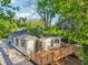 Backyard view showcasing a wooden deck perfect for outdoor entertaining, complemented by mature trees at 39 Wyman Se St, Atlanta, GA 30317
