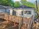 Rear view of house showcasing a wooden deck with stairs and outdoor space at 39 Wyman Se St, Atlanta, GA 30317