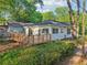 Rear view of a home highlighting a spacious wooden deck with access to the backyard at 39 Wyman Se St, Atlanta, GA 30317