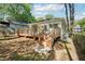 A spacious wooden deck adds outdoor living space to this home, with a large backyard in a shady setting at 39 Wyman Se St, Atlanta, GA 30317
