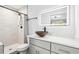 Renovated bathroom with tiled shower, modern vanity, and vessel sink at 39 Wyman Se St, Atlanta, GA 30317