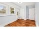 Bright bedroom features hardwood flooring, lots of natural light from multiple windows and a closet at 39 Wyman Se St, Atlanta, GA 30317