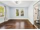 Bedroom with hardwood flooring and a window for natural light; a full bathroom is visible to the side at 39 Wyman Se St, Atlanta, GA 30317