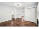 Bedroom featuring hardwood flooring, a ceiling fan, a window, and a bathroom with a vanity sink at 39 Wyman Se St, Atlanta, GA 30317