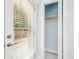 Small closet beside a door with wooden shelf, offering essential storage solutions at 39 Wyman Se St, Atlanta, GA 30317