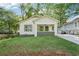 Charming bungalow with a welcoming front porch and well-maintained lawn in a tree-lined neighborhood at 39 Wyman Se St, Atlanta, GA 30317