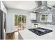 Well-lit modern kitchen featuring stainless appliances and a cooktop island at 39 Wyman Se St, Atlanta, GA 30317