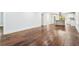 Open living area with rich hardwood floors leads to the modern kitchen at 39 Wyman Se St, Atlanta, GA 30317