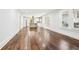 Open-concept living room with hardwood floors flowing into the bright kitchen area with stainless appliances at 39 Wyman Se St, Atlanta, GA 30317
