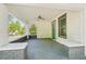 Inviting covered porch with brick accents, offering a comfortable outdoor space with a ceiling fan at 39 Wyman Se St, Atlanta, GA 30317