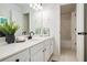 Well-lit bathroom with a large vanity and a shower over the tub at 448 Cape Ivey Dr, Dacula, GA 30019