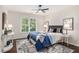 Charming bedroom featuring a comfortable bed and a stylish rug, perfect for a restful retreat at 448 Cape Ivey Dr, Dacula, GA 30019