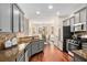 Spacious kitchen with modern appliances, granite countertops, and hardwood floors at 448 Cape Ivey Dr, Dacula, GA 30019