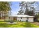 View of the home and backyard featuring a fire pit at 2013 Ridge Rd, Dallas, GA 30157