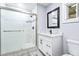 Modern bathroom features a glass-enclosed shower, black fixtures, and a marble countertop at 2013 Ridge Rd, Dallas, GA 30157