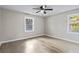 Bright bedroom with natural lighting, hardwood floors, and a ceiling fan at 2013 Ridge Rd, Dallas, GA 30157