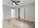 Bedroom with neutral paint, hardwood floors, ceiling fan and two large windows for plenty of natural light at 2013 Ridge Rd, Dallas, GA 30157