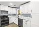Modern kitchen featuring white cabinets and stainless appliances at 2013 Ridge Rd, Dallas, GA 30157