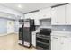Modern kitchen featuring stainless steel appliances, white cabinets, and light-colored countertops at 2013 Ridge Rd, Dallas, GA 30157