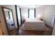 Bright bedroom with large mirror, hardwood floors, and natural light at 2881 Parrott Nw Ave, Atlanta, GA 30318